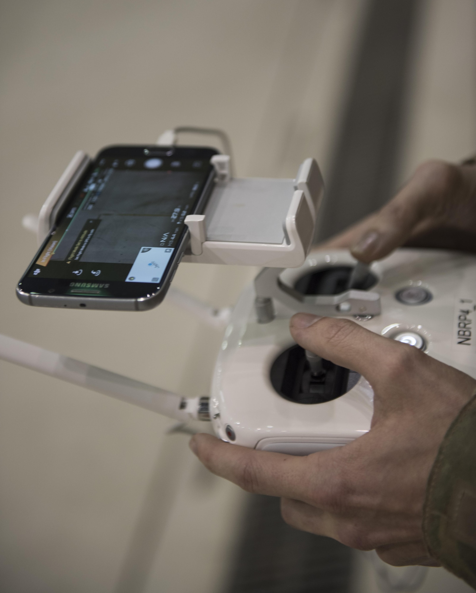 Senior Airman Justin Steward, 455th Expeditionary Security Forces Squadron, pilots an unmanned aircraft system during a live-demonstration at Bagram Airfield, Afghanistan, June 30, 2017. UAS present new challenges to the battlefield, so to counter this, defenders are learning how to pilot drones and employ the same strategies, in training environments, our enemies may use. (U.S. Air Force photo by Staff Sgt. Benjamin Gonsier)