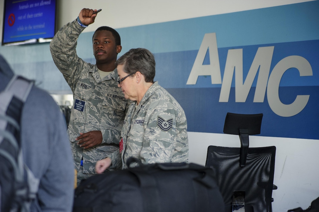 Senior Airman Marquise White and Tech. Sgt. Renee Kiger, Citizen Airmen with JB Charleston's 81st Aerial Port Squadron, perform customer service at the Ramstein Air Base Passenger Terminal, July 13, 2017.  Reservists from Charleston conducted two weeks of annual training at Ramstein AB in order to help ensure operational readiness. (U.S. Air Force photo by Senior Airman Jonathan Lane)