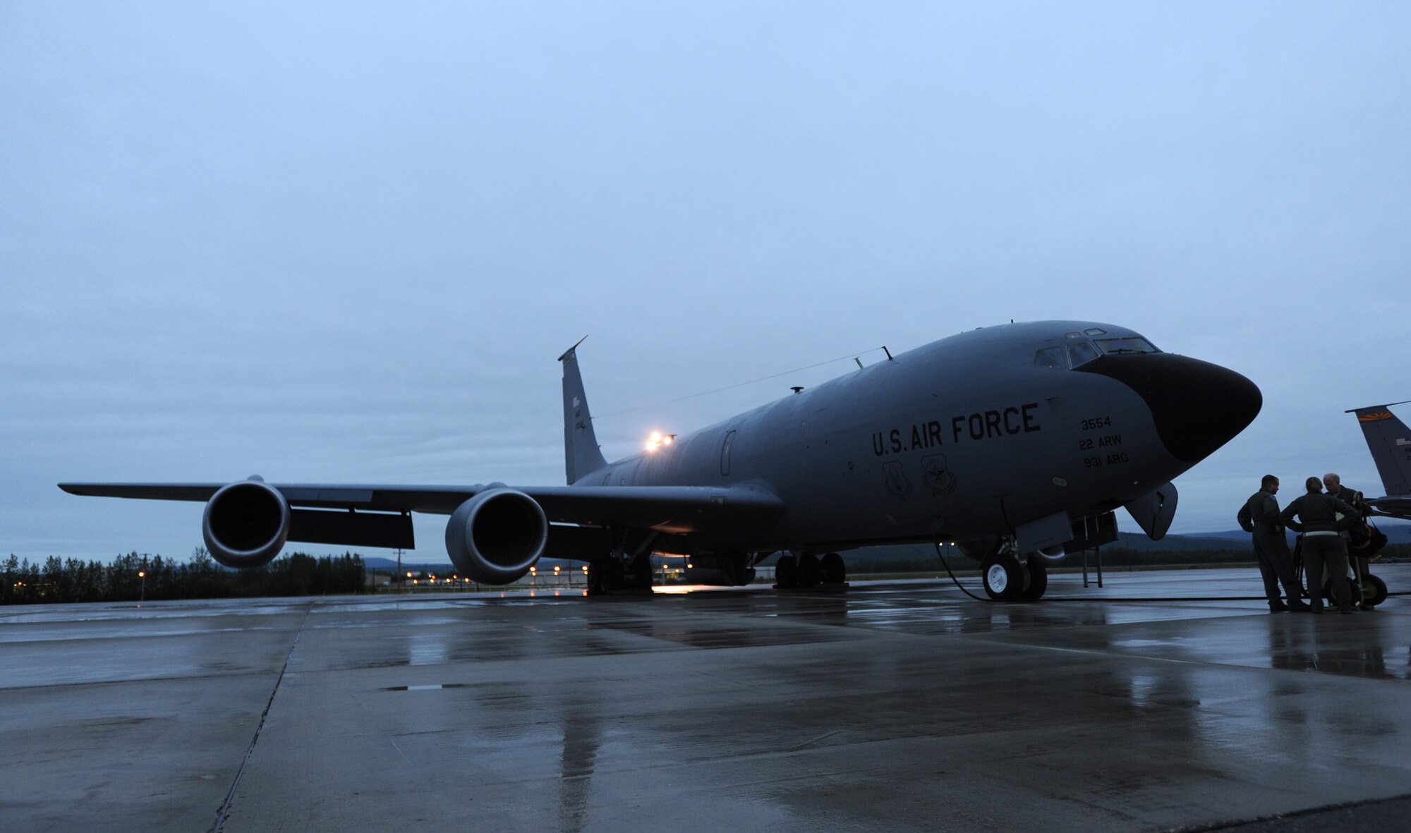 Aircrew and maintenance Airmen review paperwork and ensure the KC-135 Stratotanker is ready to fly, July 12, 2017, at Eielson Air Force Base, Alaska. This KC-135 took part in exercise Talisman Saber 2017. (U.S. Air Force photo/Staff Sgt. Rachel Waller)