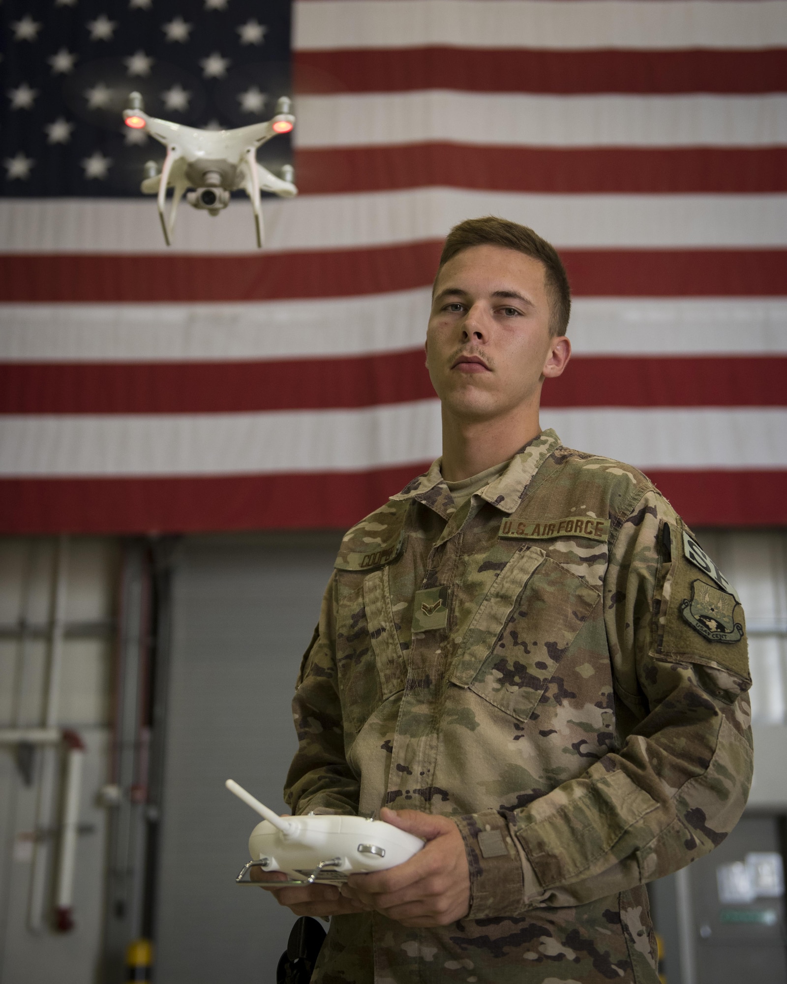 Airman 1st Class Brandon Cooper is defender with the 455th Expeditionary Security Forces Squadron. To counter the challenges that unmanned aircraft systems pose on the battlefield, the team is training to pilot and use the drones, so enemy tactics can be replicated and used to train coalition forces on how to react to them. Cooper is deployed out of Joint Base San Antonio, Lackland Air Force Base, Texas, and is a native of North Carolina. (U.S. Air Force photo by Staff Sgt. Benjamin Gonsier) 