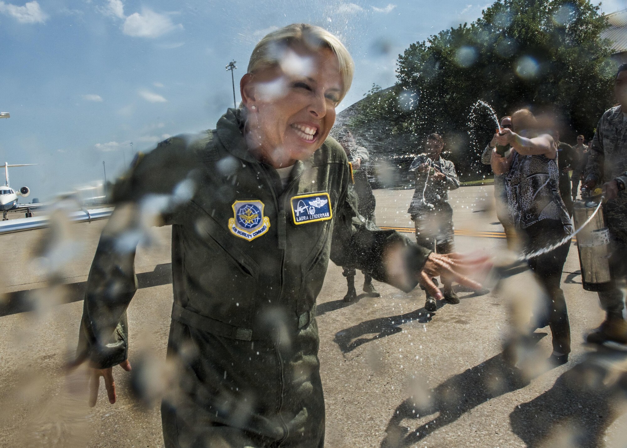 Col. Laura Lenderman, the Scott Air Force Base installation commander, celebrates her two-year command of the 375th Air Mobility Wing through a fini flight, July 10, 2017. Lenderman grew up on Scott AFB as a child, where her father served at Headquarters Military Airlift Command and inspired her to follow the same military path while creating her own legacy. As the installation celebrates its 100th year, standing as the Air Force's third oldest base, Lenderman leaves behind a legacy of caring for Airmen, strengthening community partnerships, and instilling innovation, communication, and excellence principles into the stitchings of the Scott AFB mission. (U.S. Air Force photo/ Tech. Sgt. Jodi Martinez)