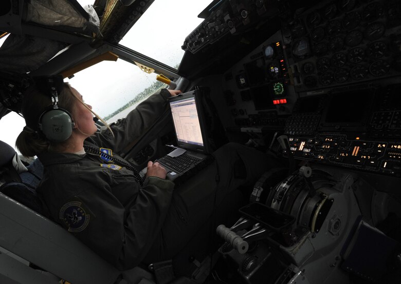 Senior Airman Kailey Simmonds, 22nd Aircraft Maintenance Squadron assistant flying crew chief, monitors a KC-135 Stratotanker assigned to McConnell Air Force Base, Kan., as it receives fuel as part of pre-flight checks, July 11, 2017, at Eielson AFB, Ala. Maintenance crews work around the clock to ensure aircraft are in working order before any flight. (U.S. Air Force photo/Staff Sgt. Rachel Waller)