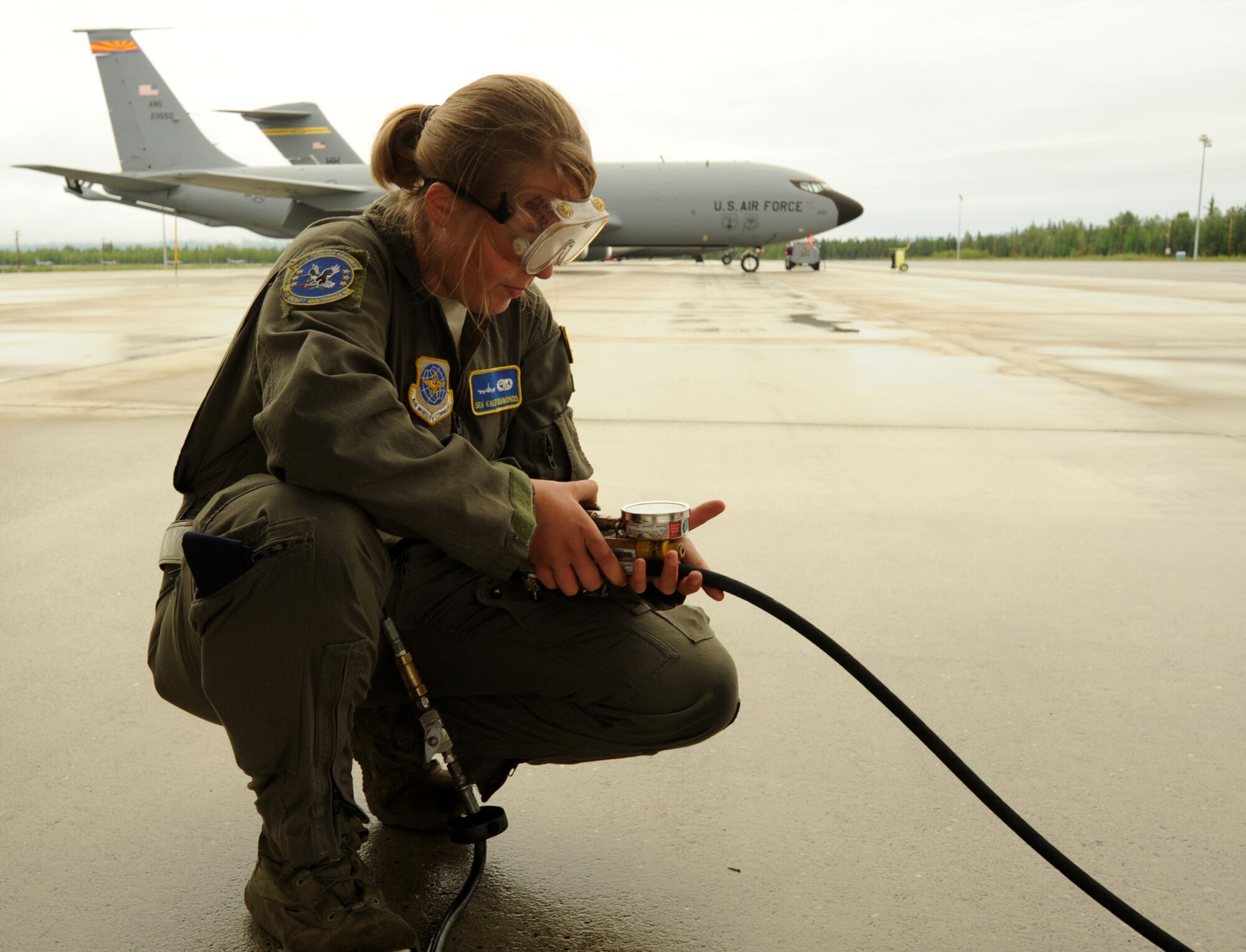 Senior Airman Kailey Simmonds, 22nd Aircraft Maintenance Squadron assistant flying crew chief, monitors a tire pressure gauge as she fills a tire with nitrogen, July 11, 2017, at Eielson Air Force Base, Ala. After the KC-135 Stratotanker receives fuel, crew chiefs ensure the tanker tires have the right amount of PSI to support the heavier aircraft. (U.S. Air Force photo/Staff Sgt. Rachel Waller)