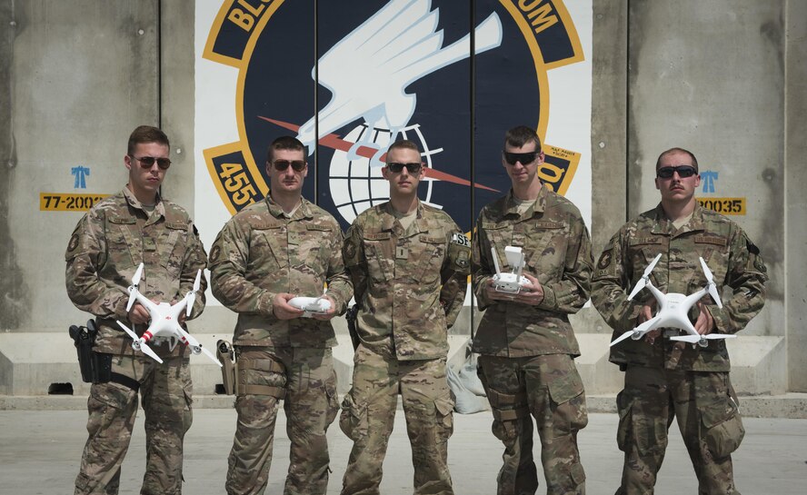 Defenders from the 455th Expeditionary Security Forces Squadron and a researcher from the Air Force Research Lab teamed up to bring a new program to Bagram Airfield. To counter the challenges that unmanned aircraft systems pose on the battlefield, the team is training to pilot and use the drones, so enemy tactics can be replicated and used to train coalition forces on how to react to them. (U.S. Air Force photo by Staff Sgt. Benjamin Gonsier)