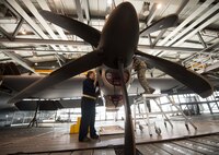 Senior Airman Rachel Revels, left, and Senior Airman Tailor Wimberly, 86th Maintenance Squadron aerospace propulsion journeymen, inspect a C-130J Super Hercules engine for wear and tear at the 86th MXS Isochronal Dock on Ramstein Air Base, Germany, July 11, 2017. Ramstein’s Isochronal Dock is designed to thoroughly inspect and repair C-130Js so that aircrews can fly safely and focus on the mission. (U.S. Air Force photo by Senior Airman Elizabeth Baker)