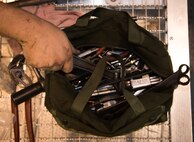 Senior Airman Tailor Wimberly, 86th Maintenance Squadron aerospace propulsion journeymen, picks up a wrench while inspecting a C-130J Super Hercules engine at the 86th MXS Isochronal Dock on Ramstein Air Base, Germany, July 12, 2017. Airmen from career fields that specialize in maintenance in different areas all over the aircraft work together in the Isochronal Dock to inspect and repair C-130s. (U.S. Air Force photo by Senior Airman Elizabeth Baker)