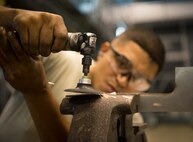 Senior Airman Jose Flores, 86th Maintenance Squadron aircraft structural maintenance journeyman, uses a vice and cutoff wheel to shape a piece of sheet metal at the 86th MXS Isochronal Dock on Ramstein Air Base, Germany, July 12, 2017. Each C-130 in Ramstein’s fleet undergoes inspections and repairs every 270 days to make sure that they are performing optimally. (U.S. Air Force photo by Senior Airman Elizabeth Baker)