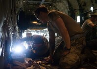 Airman 1st Class Patrick Hailey, right, 86th Maintenance Squadron repair and reclamation apprentice, and Tech. Sgt. Scott Holman, 86th MXS repair and reclamation NCO in charge, inspect a C-130J Super Hercules for wear and tear at the 86th MXS Isochronal Dock on Ramstein Air Base, Germany, July 12, 2017. Airmen from career fields that specialize in maintenance in different areas all over the aircraft work together in the Isochronal Dock to inspect and repair C-130s. (U.S. Air Force photo by Senior Airman Elizabeth Baker)