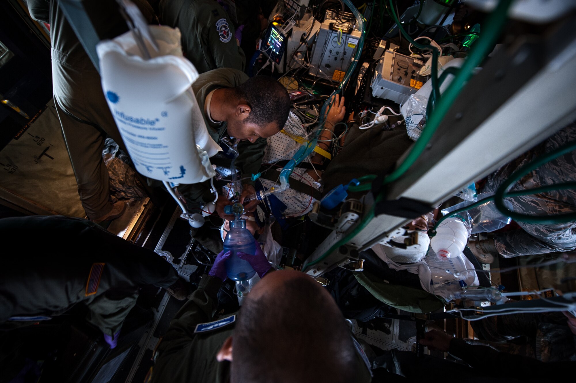 U.S. Air Force Airmen assigned to the 86th Medical Squadron’s Critical Care Air Transportation Team and 86th Aeromedical Evacuation Squadron perform a training exercise aboard a C-130J Super Hercules on the flightline on Ramstein Air Base, Germany, July 12, 2017. CCATT and AE members said one of the biggest challenges they faced in the exercise was the lack of space on the aircraft with the amount of people involved. (U.S. Air Force photo by Senior Airman Devin Boyer)