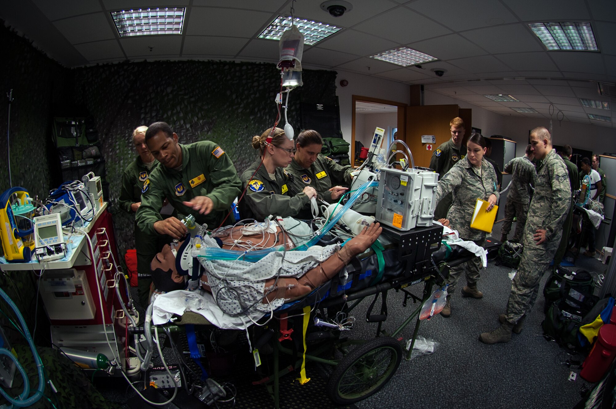 The 86th Medical Squadron Critical Care Air Transportation Team packages a mannequin patient in preparation for transport during a training exercise at the Simulation Center on Ramstein Air Base, Germany, July 12, 2017. The purpose of the training was to build working relationships between medical entities while increasing the clinical and readiness skills of the Airmen performing in the exercise. (U.S. Air Force photo by Senior Airman Devin Boyer)