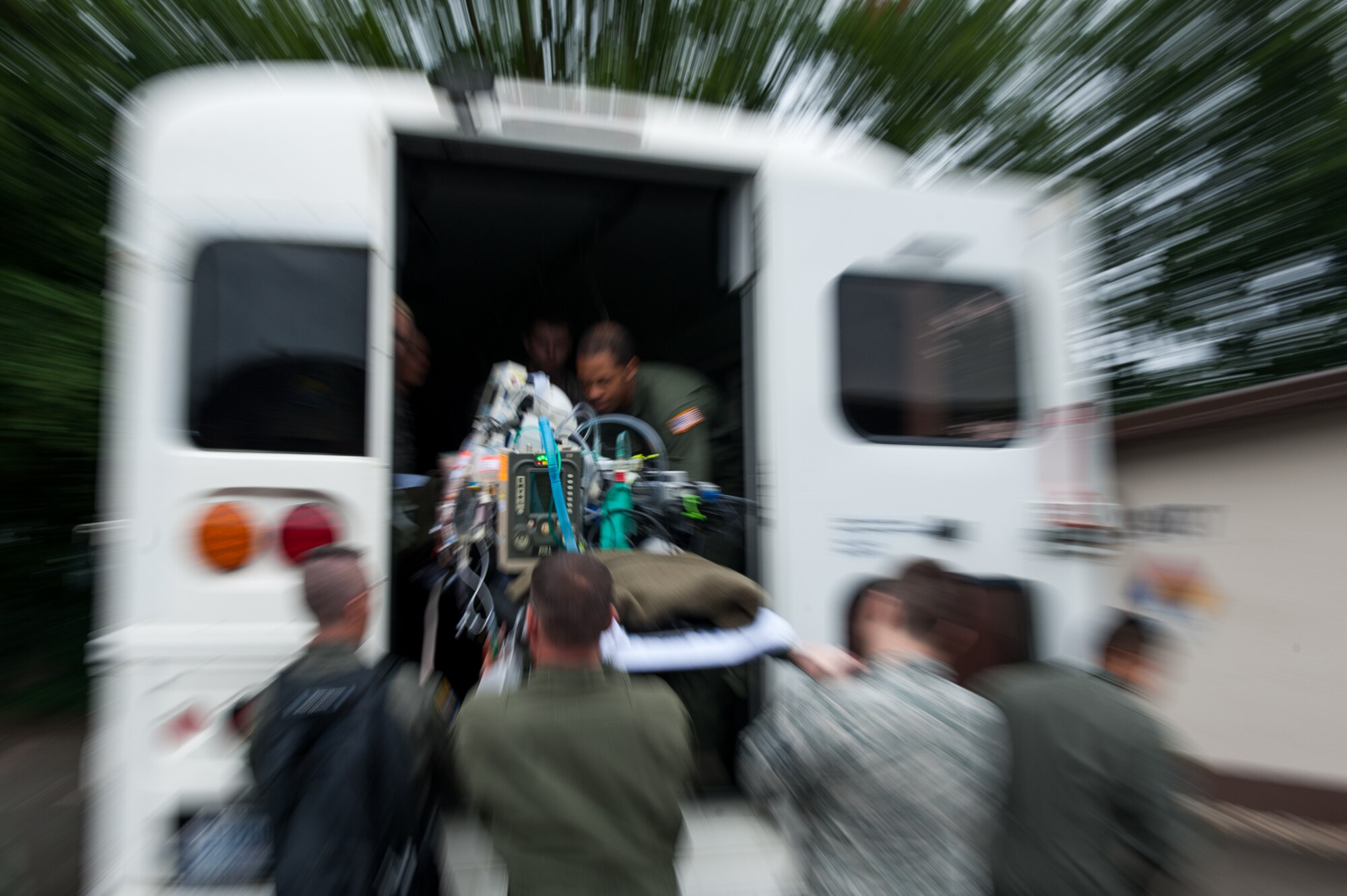 The 86th Medical Squadron Critical Care Air Transportation Team loads a mannequin patient onto a bus during a training exercise at the Simulation Center on Ramstein Air Base, Germany, July 12, 2017. The team transported two critical care patients to the flightline where they continued their training. (U.S. Air Force photo by Senior Airman Devin Boyer)