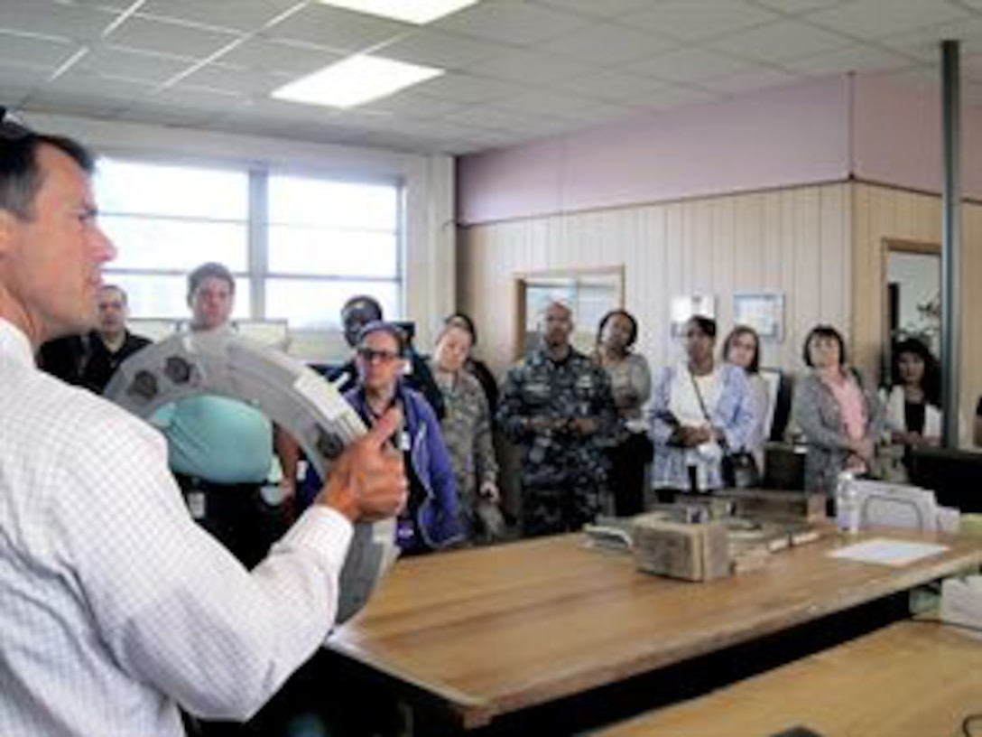 John Danko, owner of Danko Arlington, displays a casting pattern developed with additive manufacturing processes to DLA Aviation employees.