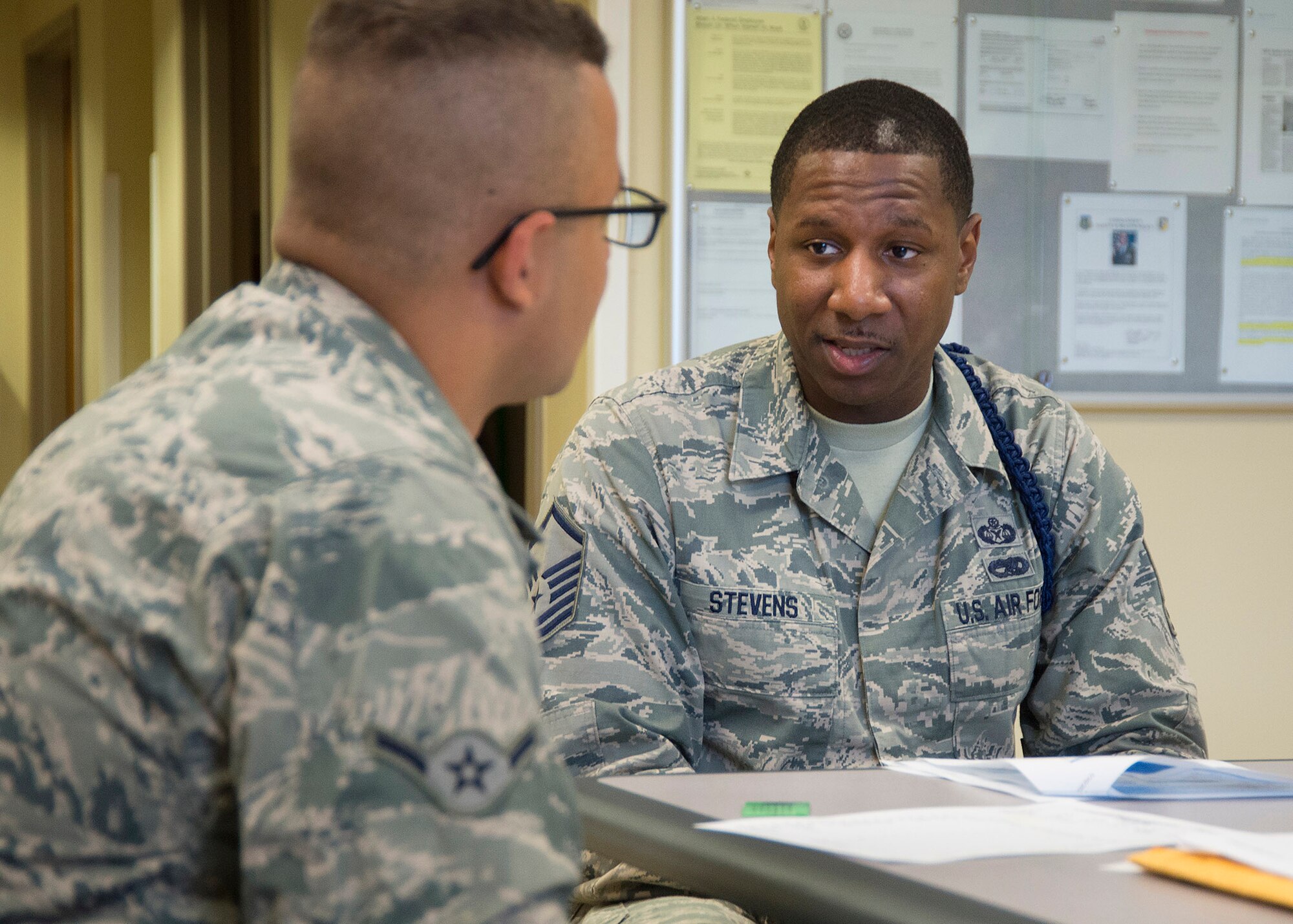 Master Sgt. Michael J. Stevens, United States Air Force School of Aerospace Medicine Military Training Flight chief, briefs a new arrival, Airman Andre Cade, checking into USAFSAM July 6, 2017, at Wright-Patterson Air Force Base, Ohio. Stevens, was named one of the Air Force’s 12 Outstanding Airmen of the Year. (U.S. Air Force photo by R.J. Oriez)