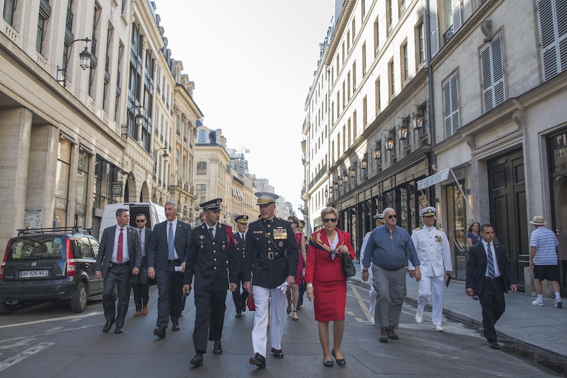 Marine Corps Gen. Joe Dunford, the chairman of the Joint Chiefs of Staff, and his wife, Ellyn, walk through the streets of Paris to attend the annual Bastille Day military parade in Paris, July 14, 2017. American troops led the parade to mark the centennial of American troops arriving in France during World War I. DoD photo by Navy Petty Officer 2nd Class Dominique Pineiro