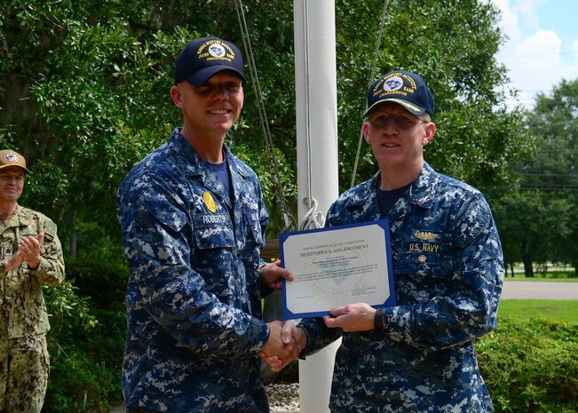 Petty Officer 1st Class Justin Roberts 628th Security Forces Flight Chief is advance through the Navy’s Meritorious Advancement Program (MAP), by Capt. Robert Hudson commander Naval Support Activity Charleston. MAP authorizes Commanding Officers (COs) to advance eligible personnel in paygrades E3, E4, and E5 to the next higher paygrade.  The program is intended to give COs and the command triad the opportunity to recognize their best Sailors by advancing them when they are ready for the next level of responsibility.