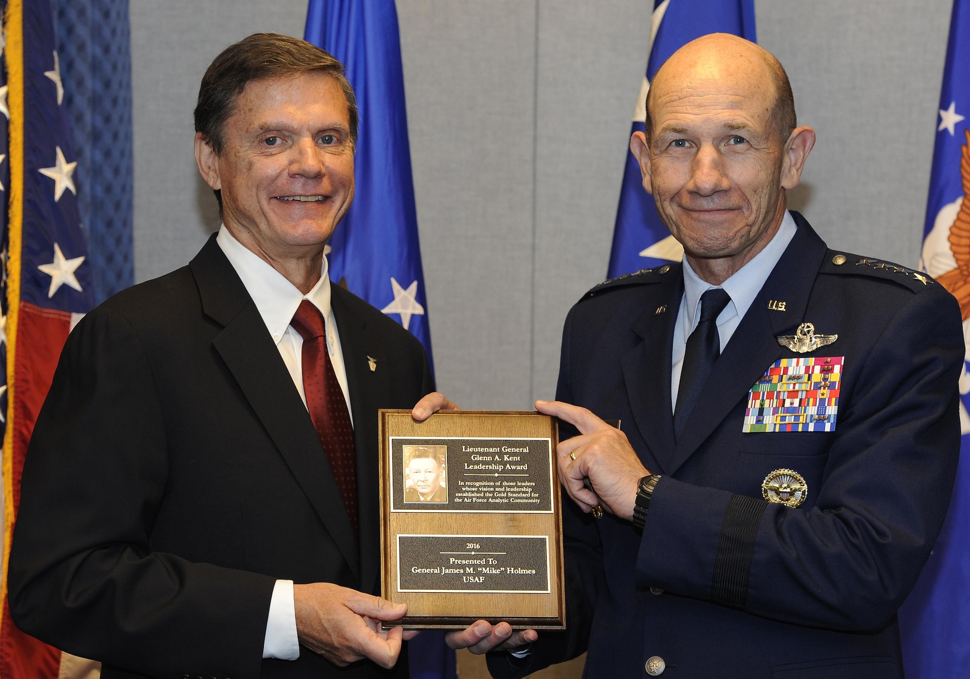 Gen. Mike Holmes, the Air Combat Command commander, is honored for analysis work with the Lt. Gen. Glenn A. Kent Leadership Award, presented by Kevin Williams, the director of Air Force Studies, Analyses and Assessments, during a July 11, 2017, ceremony at the Pentagon. The Kent Award recognizes influential leaders who have had substantive analytic responsibilities during their career and whose vision and leadership have had a significant and lasting effect on the achievements of Air Force analysis. (U.S. Air Force photo/Tech. Sgt. Robert Barnett)