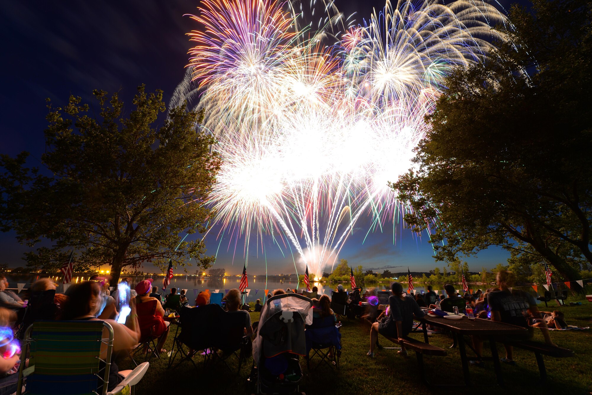 Fireworks fill the sky on July 8, 2017 at Offutt’s base lake during the annual fireworks display. Several family activities took place at the celebration including face painting, treasure hunt and a performance from the Heartland of America Band. (U.S. Air Force photo by Zachary Hada)