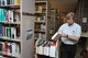 Dwight Goforth, a library technician at the D'Azzo Research Library, places books back into circulation. Today, the library includes more than one million items. (U.S. Air Force photo/Bryan Ripple)