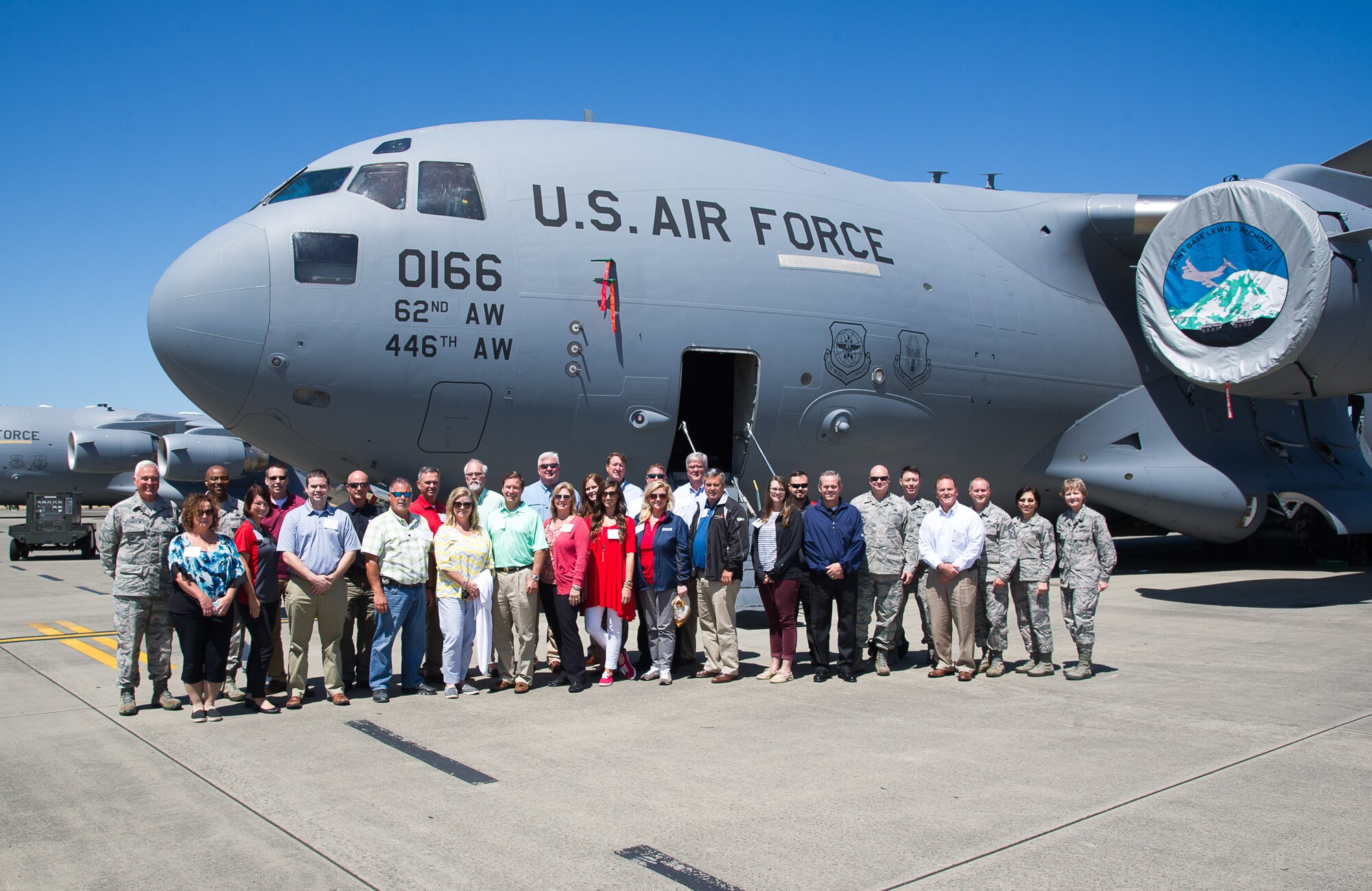 Civic leaders from Georgia pause from checking out a 446th Airlift ‘Rainier’ Wing C-17 static display during their Civic Leader Tour at McChord Field July 11. The C-17 static was manned by Aeromedical Evacuation members, Flying Crew Chiefs, loadmasters and pilots. (U.S. Air Force photo by David L. Yost)