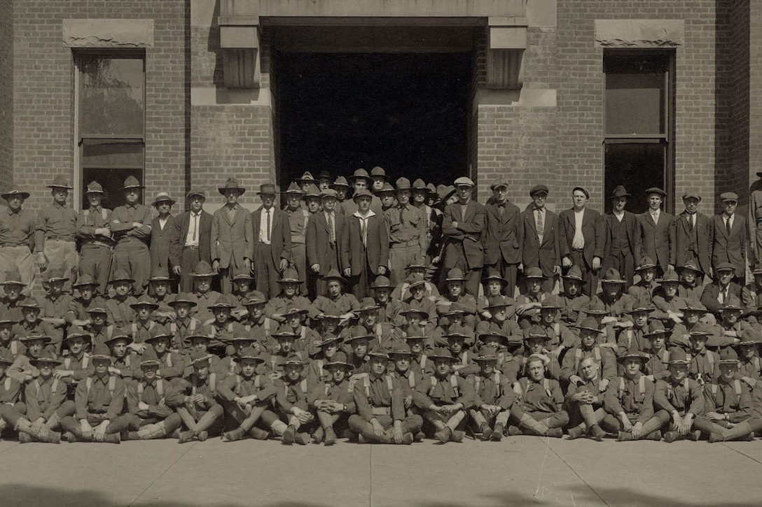 New York National Guard soldiers assigned to Company G, 1st New York State Infantry, gather outside the armory in Oneonta, N.Y., in July 1917, following their mobilization for duty in World War I. The men not in uniform were new recruits. New York State Military History Museum photo