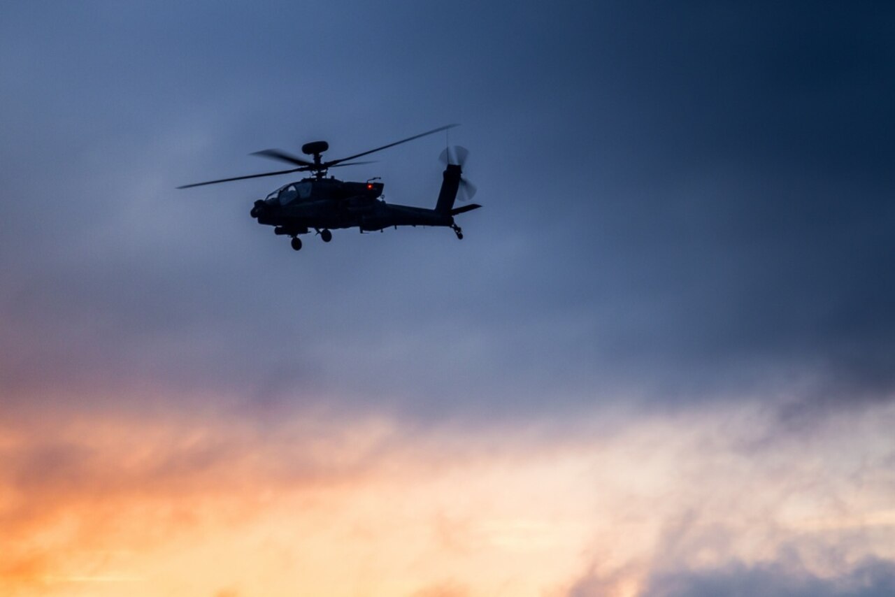 Army AH-64E Apache helicopter pilots, assigned to 16th Combat Aviation Brigade, 7th Infantry Division, fly overhead as sun’s light fades over Joint Base Lewis-McChord, Wash., May 25, 2016. Training in the dark prepares aviators for the challenges they might face on real-world missions. Apaches are among the equipment the United States has sold to India as part of the two nations’ growing defense relationship. Army photo by Capt. Brian Harris