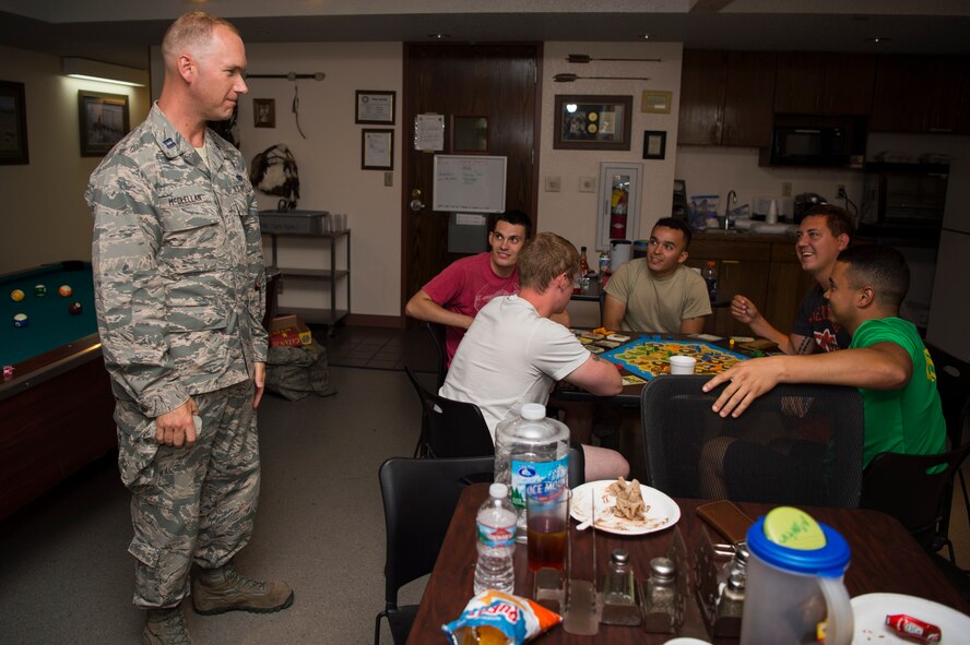 Captain Samuel McClellan, 90th Missile Wing chaplain, thanks security forces plus maintenance members, chefs and missile crew for their sacrifices and hard work during the 319th Missile Squadron code change burger burn in the 90th Missile Wing missile complex, July 12, 2017. The week-long code change sometimes requires security forces members and maintainers to stay out for days at a time to ensure they accomplish their mission. (U.S. Air Force photo by Staff Sgt. Christopher Ruano)