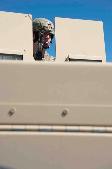 Airman Luke Bittle, 790th Missile Security Forces Squadron security forces member, mans the turret atop a Humvee during code change at a launch facility in the 90th Missile Wing missile complex, June 20, 2017. Defenders are charged with the security of 150 Minuteman III ICBMs and their related infrastructure spread throughout a 9,600 square-mile area across Wyo., Neb., and Colo. Code change ensures the safety, security and effectiveness of America’s ICBM arsenal, which is the bedrock of nuclear deterrence. (U.S. Air Force photo by Staff Sgt. Christopher Ruano) 