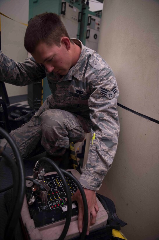 Senior Airman Logan Hershberger, 90th Missile Maintenance Squadron electromechanical team chief, hooks up a controller monitor to launch facility equipment preparing for code change operations in the 90th Missile Wing missile complex, June 20, 2017. The cryptographic codes are changed at least once a year, and the process can take up to two weeks. Code change ensures the safety, security and effectiveness of America’s ICBM arsenal, which is the bedrock of nuclear deterrence. (U.S. Air Force photo by Staff Sgt. Christopher Ruano) 