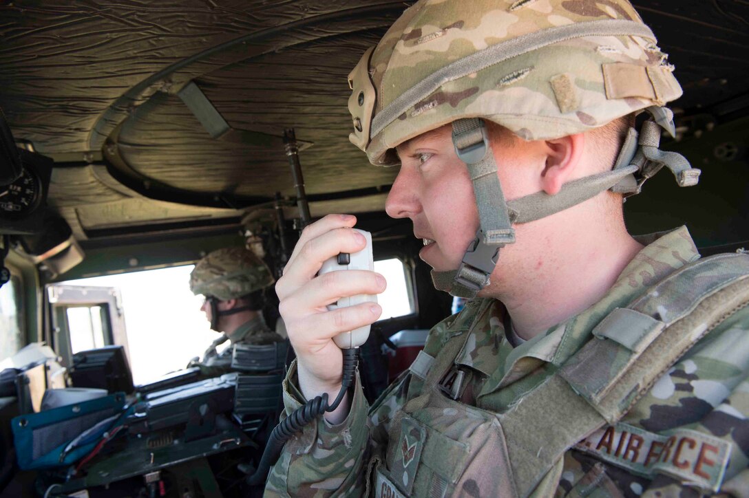 Senior Airman Marcus Graham and Airman 1st Class Nicholas Bennett, 790th Missile Security Forces Squadron security forces members, keep watch outside a launch facility in the 90th Missile Wing missile complex, June 20, 2017. Security forces provides a haven for the 90th Missile Maintenance Squadron during code change enforcing a safe and secure environment to work in. Code change ensures the safety, security and effectiveness of America’s ICBM arsenal, which is the bedrock of nuclear deterrence. (U.S. Air Force photo by Staff Sgt. Christopher Ruano)