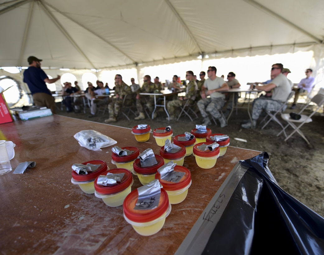 Homemade explosives sit on a table as an FBI Special Agent Bomb Technician instructs a group of 28th Civil Engineer Squadron Explosive Ordinance Disposal Airmen and members of various law enforcement agencies during a National Improvised Explosive Familiarization course at Ellsworth Air Force Base, S.D., July 12, 2017. The joint training exercise provides an opportunity for several agencies to work together, strengthening their interoperability and readiness in case of a real-world emergency. (U.S. Air Force photo by Airman 1st Class Randahl J. Jenson) 