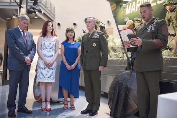 Dave Gettings, Cori Gettings, Julie Gettings, and Marine Corps Gen. Joseph F. Dunford Jr., chairman of the Joint Chiefs of Staff, listen to the Silver Star Medal Citation for Marine Cpl. Albert Gettings during the 100th Anniversary Mess Night of the 2nd Battalion, 6th Marine Regiment, at the National Marine Corps Museum in Quantica, Va., July 7, 2017. During the event, Dunford posthumously awarded the Silver Star Medal to the family of Marine Cpl. Albert Gettings, who died of wounds sustained due to enemy small-arms fire while conducting combat operations in Fallujah, Iraq in 2006.