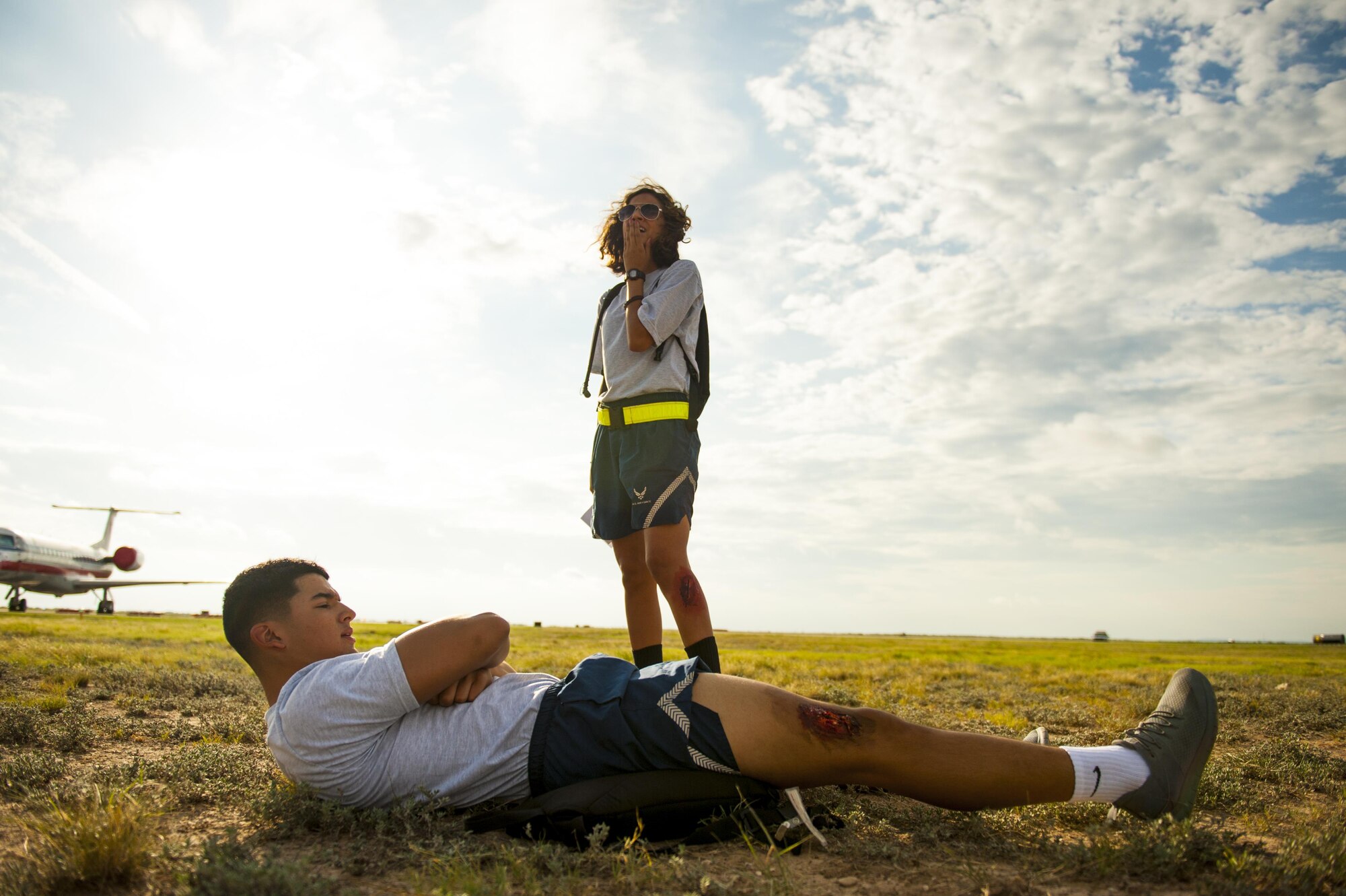 Air Force crisis actors await emergency service help during a plane crash exercise at the Mathis Regional Airport San Angelo, Texas, July 13, 2017. Goodfellow Air Force Base supplied volunteers to act for the city to practice emergency incidents. (U.S. Air Force photo by Senior Airman Scott Jackson/Released)