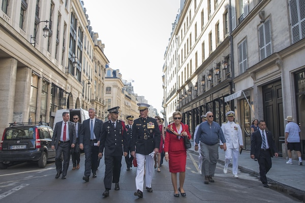 Marine Corps Gen. Joe Dunford, the chairman of the Joint Chiefs of Staff, and his wife, Ellyn, walk through the streets of Paris to attend the annual Bastille Day military parade in Paris, July 14, 2017. American troops led the parade to mark the centennial of American troops arriving in France during World War I.