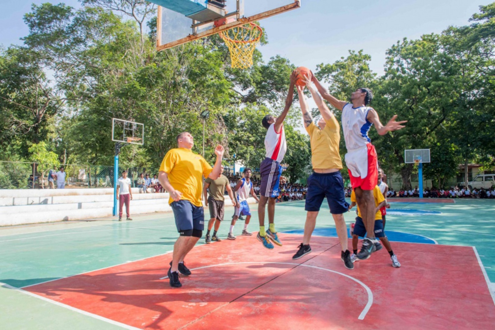Nimitz Carrier Strike Group Sailors play basketball against students from the YMCA College of Physical Education in Chennai, India while participating in a community relations project during Malabar 2017. Malabar 2017 is the latest in a continuing series of exercises between the Indian Navy, Japan Maritime Self Defense Force and U.S. Navy that has grown in scope and complexity over the years to address the variety of shared threats to maritime security in the Indo-Asia-Pacific region. 