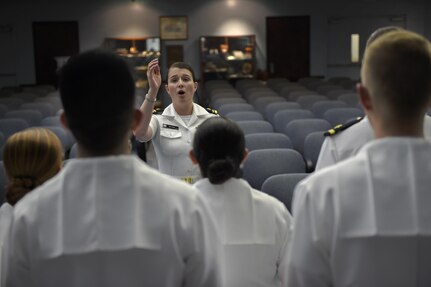 U.S. Navy Lt. Megan Brown, Navy Nuclear Power Training Command enlisted heat transfer instructor and choir director, leads the choir during a practice at the NNPTC building, July 12. The choir practices together one to two times a week.