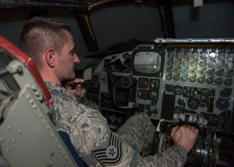 Tech. Sgt. Benjamin Whitfield, 92nd Air Refueling Wing historic property custodian, sits in the cockpit of a vintage B-52 simulator dubbed “Alpine Clover" July 10, 2017, at Fairchild Air Force Base, Washington. Revolutionary during its time, these simulators could be driven by rail to any base that needed training. (U.S. Air Force photo / Airman 1st Class Ryan Lackey)