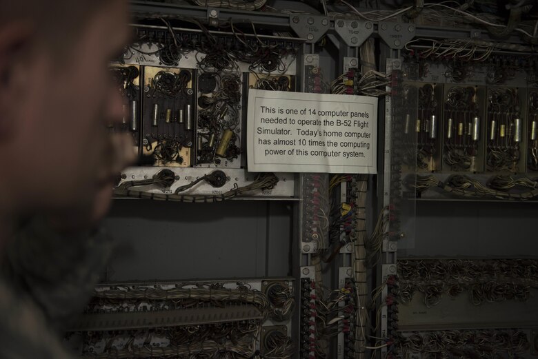 Tech. Sgt. Benjamin Whitfield, 92nd Air Refueling Wing historic property custodian, displays the "brain" of a vintage B-52 simulator dubbed “Alpine Clover" July 10, 2017, at Fairchild Air Force Base, Washington. Created in the late 1950's to help train B-52 pilots, these simulators saw numerous updates before retiring in the late 1980's. (U.S. Air Force photo / Airman 1st Class Ryan Lackey)