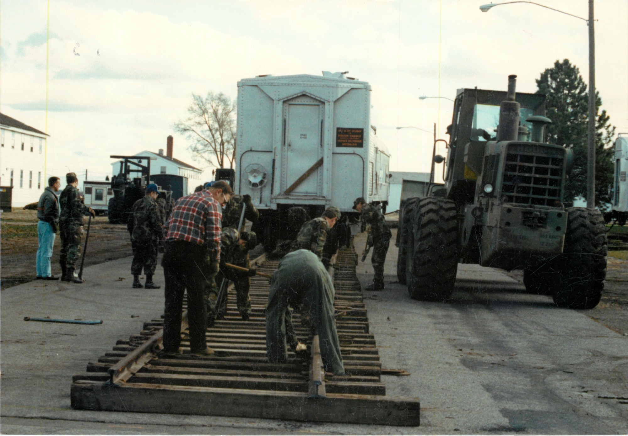 Volunteer workers lay tracks as part of Operation Cannonball Nov. 8, 1990, at Fairchild Air Force Base, Washington. (U.S. Air Force courtesy photo)
