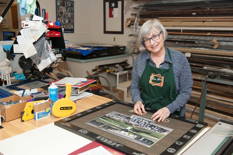 Sue Keys, Arts and Crafts Center custom picture framer, poses for a photo at Beale Air Force Base, Calif., July 13, 2017. (U.S. Air Force photo/Senior Airman Justin Parsons)