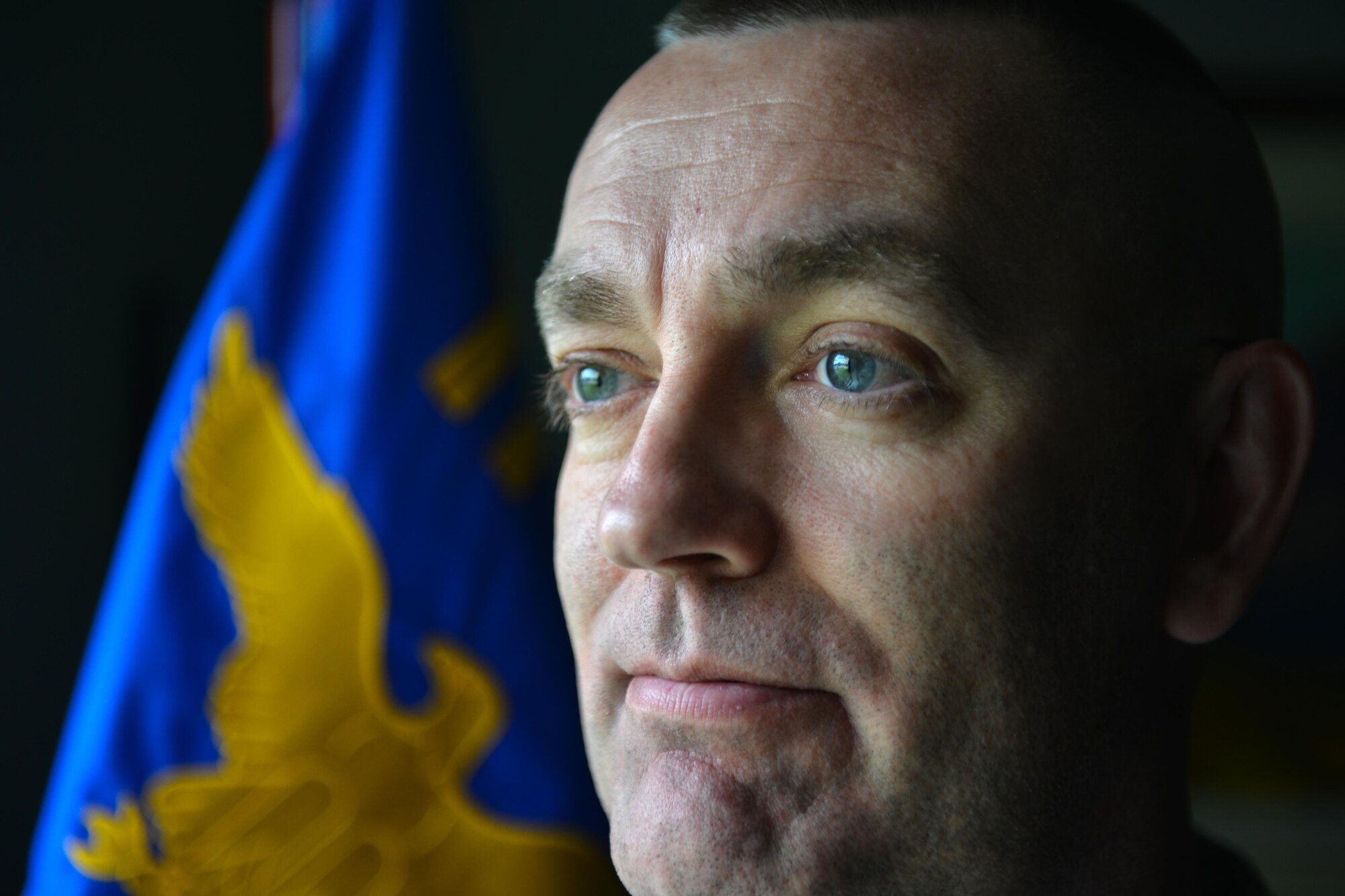 673d Air Base Wing Command Chief Master Sgt. Garry Berry looks out his window July 5, 2017. After 30 years of service, Berry retired July 14, 2017.