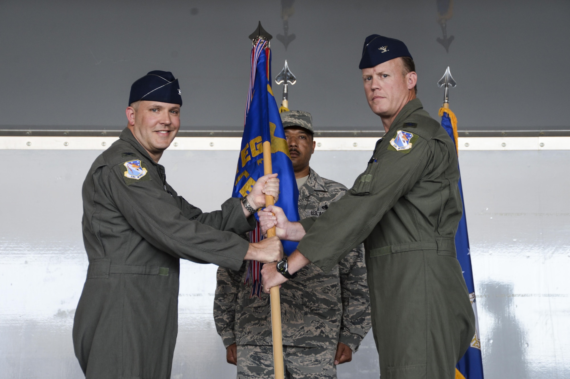 Col. Brian Schafer assumes command of the 53rd Test and Evaluation Group from Col. David Abba, 53rd Wing commander, at Nellis Air Force Base, Nev., July 11, 2017. The 53rd TEG is responsible for the overall execution of the 53rd Wing’s flying activities. (U.S. Air Force photo by Airman 1st Class Andrew D. Sarver/Released)