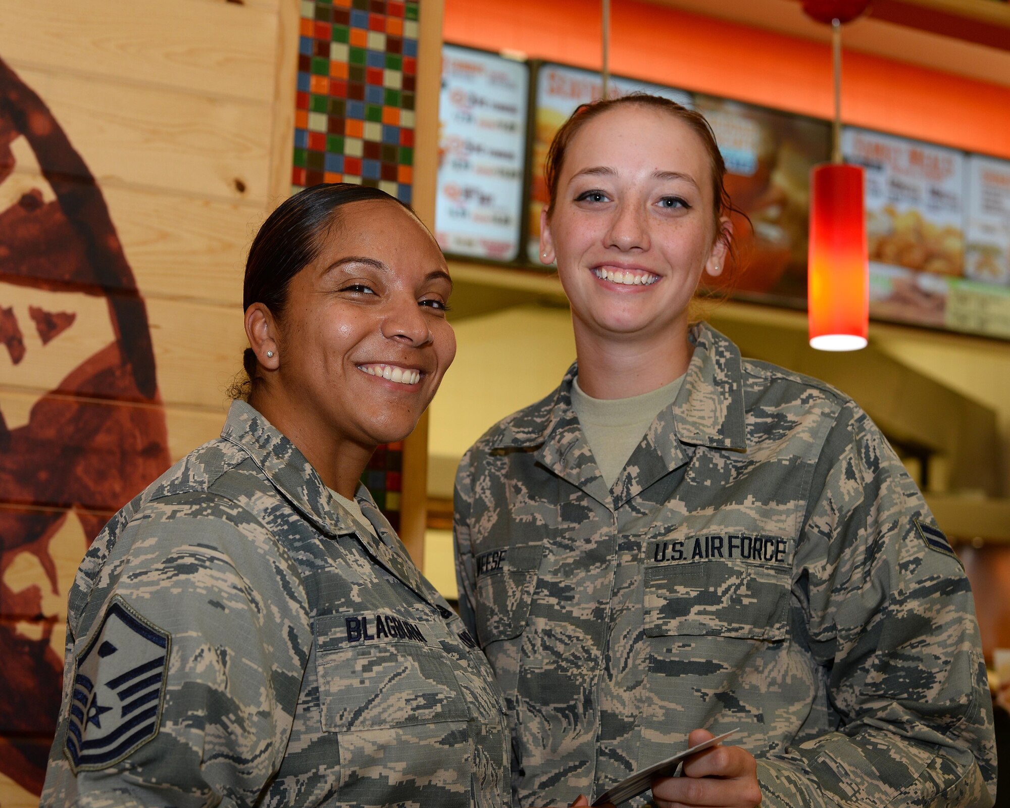 U.S. Air Force Master Sgt. Danette Blagburn, 355th Medical Group first sergeant, presents a gift card for the base exchange to Airman 1st Class Lindsey Weese, 355th Logistics Readiness Squadron material management specialist, at Davis-Monthan Air Force Base, Ariz., July 13, 2017. Weese received the gift card as part of the First Sergeant Council’s random acts of kindness event. (U.S. Air Force photo by Airman 1st Class Michael X. Beyer)