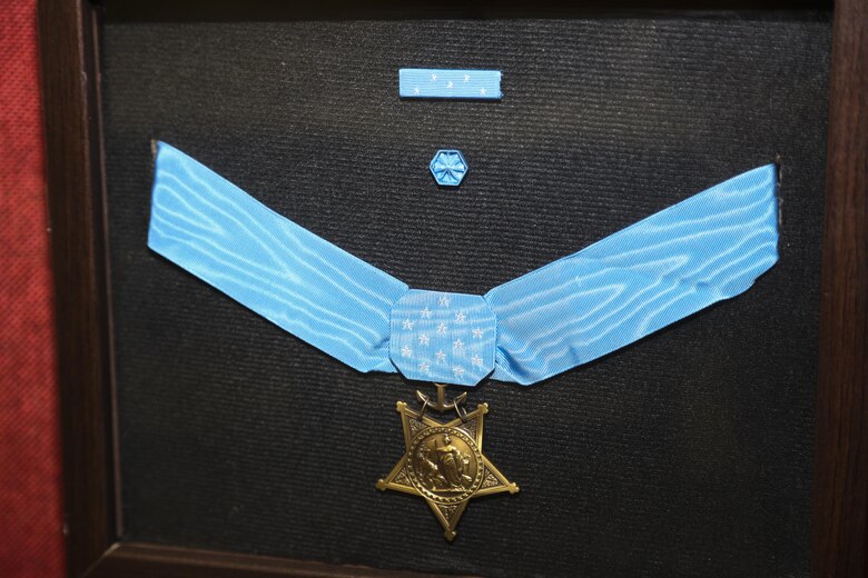 The Medal of Honor is put on display at a room dedication ceremony for a U.S. Marine Corps Medal of Honor recipient Col. Robert J. Modrzejewski ret. at the Advanced Infantry Training Battalion, School of Infantry West, Camp Pendleton, Calif;, July 14, 2017. 

The ceremony was held to dedicate a classroom, now called the Hall of Heroes, to the Medal of Honor recipients of the past and present. Colonel Robert J. Modrzejewski, a Medal of Honor recipient who retired from the Marine Corps in 1986, was the ceremony’s guest of honor. (U.S. Marine Corps photo by Pfc. Noah Rudash)