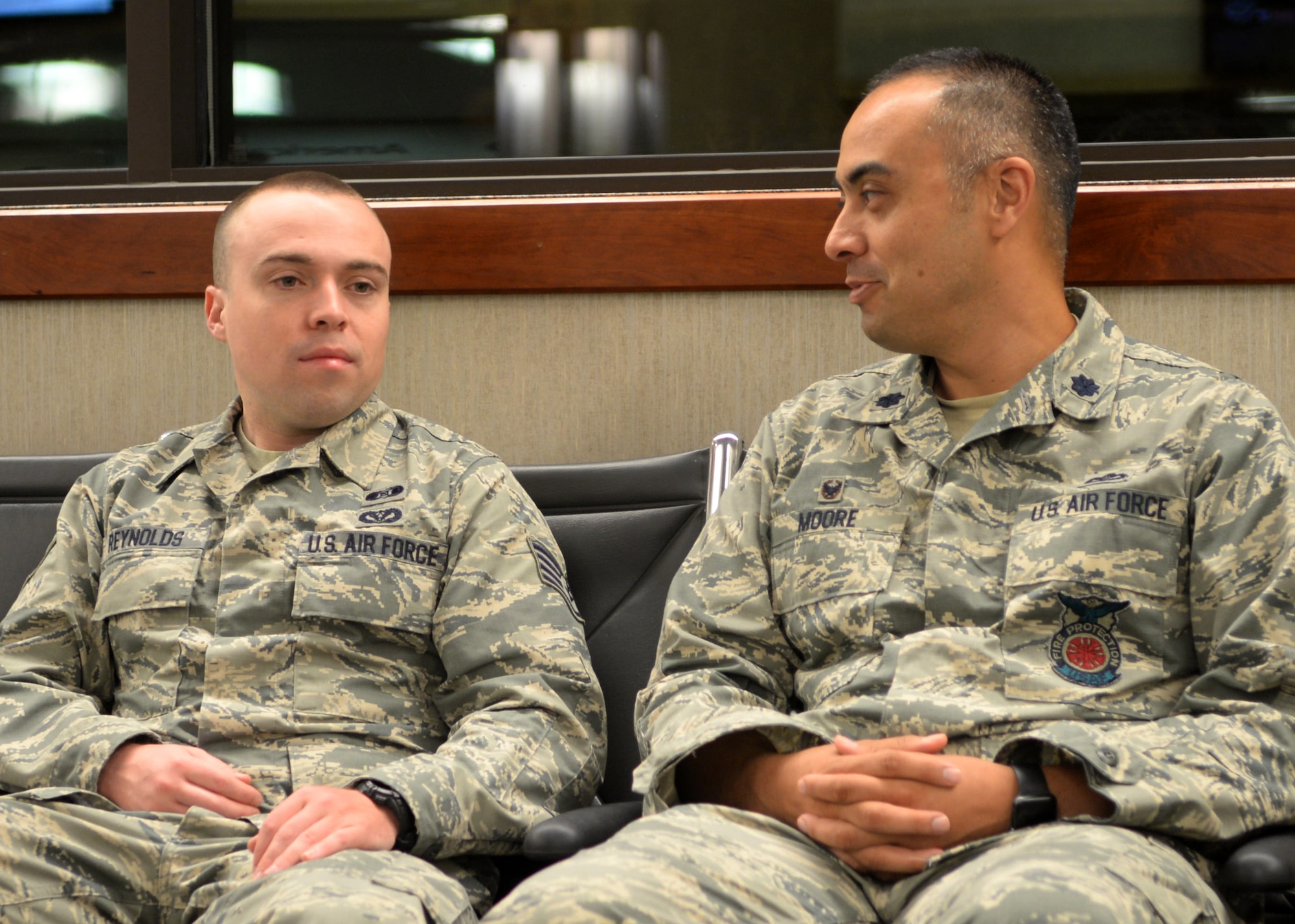 Staff Sgt. Ronald Reynolds, an emergency management technician assigned to the 28th Civil Engineer Squadron, visits with Lt. Col. Gary Moore, 28th CES commander, before deploying from Rapid City Regional Airport in Box Elder, S.D., July 12, 2017. Throughout the summer, several Airmen from the 28th CES will deploy to 10 different countries in the area of U.S. Africa Command and U.S. Central Command responsibility. (U.S. Air Force photo by Senior Airman Denise M. Jenson)