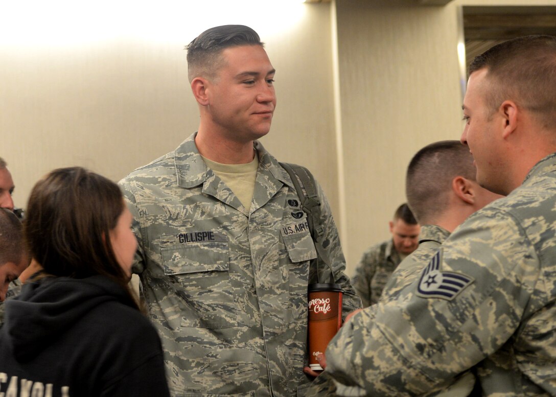 Senior Airman James Gillispie, an emergency management technician assigned to the 28th Civil Engineer Squadron, says goodbye to friends and coworkers as he prepares to deploy from Rapid City Regional Airport in Box Elder, S.D., June 12, 2017. The Airmen are deploying in support of the Air Forces infrastructure needs, which includes heating and cooling systems, airfield repair, rubber removal and other operations. (U.S. Air Force photo by Senior Airman Denise M. Jenson)
