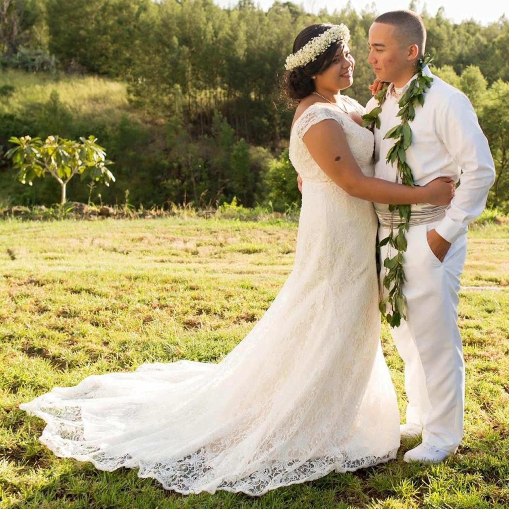 Senior Airman Kaiea Hokoana, 90th Security Forces Squadron installation patrolman, and Airman 1st Class Veulah Hokoana, 90th Force Support Squadron missile chef, pose for a wedding photo in Kula, Hawaii, Oct. 8, 2016. A week prior to the Hokoanas’ wedding, they provided lifesaving assistance to a motorcyclist injured in an accident which contributed to saving the man’s life. Kaiea received the Air Force Commendation Medal for his actions during an award ceremony in Cheyenne, Wyo., July 14, 2017. (U.S. Air Force courtesy photo) 