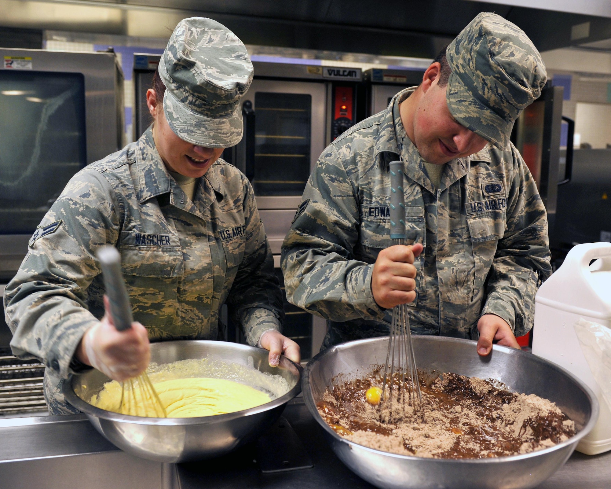 Airman 1st Class Jennifer Wascher, 56th Force Support Squadron food service journeyman, and Airman 1st Class Avery Edwards, 56th FSS food service journeyman, prep a midnight meal July 13, 2017 at Luke Air Force Base, Ariz. The Falcon Inn Dining Facility and the Ray V. Hensman Dining Facility sent five Airmen to receive culinary training at Birt’s Bistro and Bookstore Restaurant. (U.S. Air Force photo by Airman 1st Class Pedro Mota)