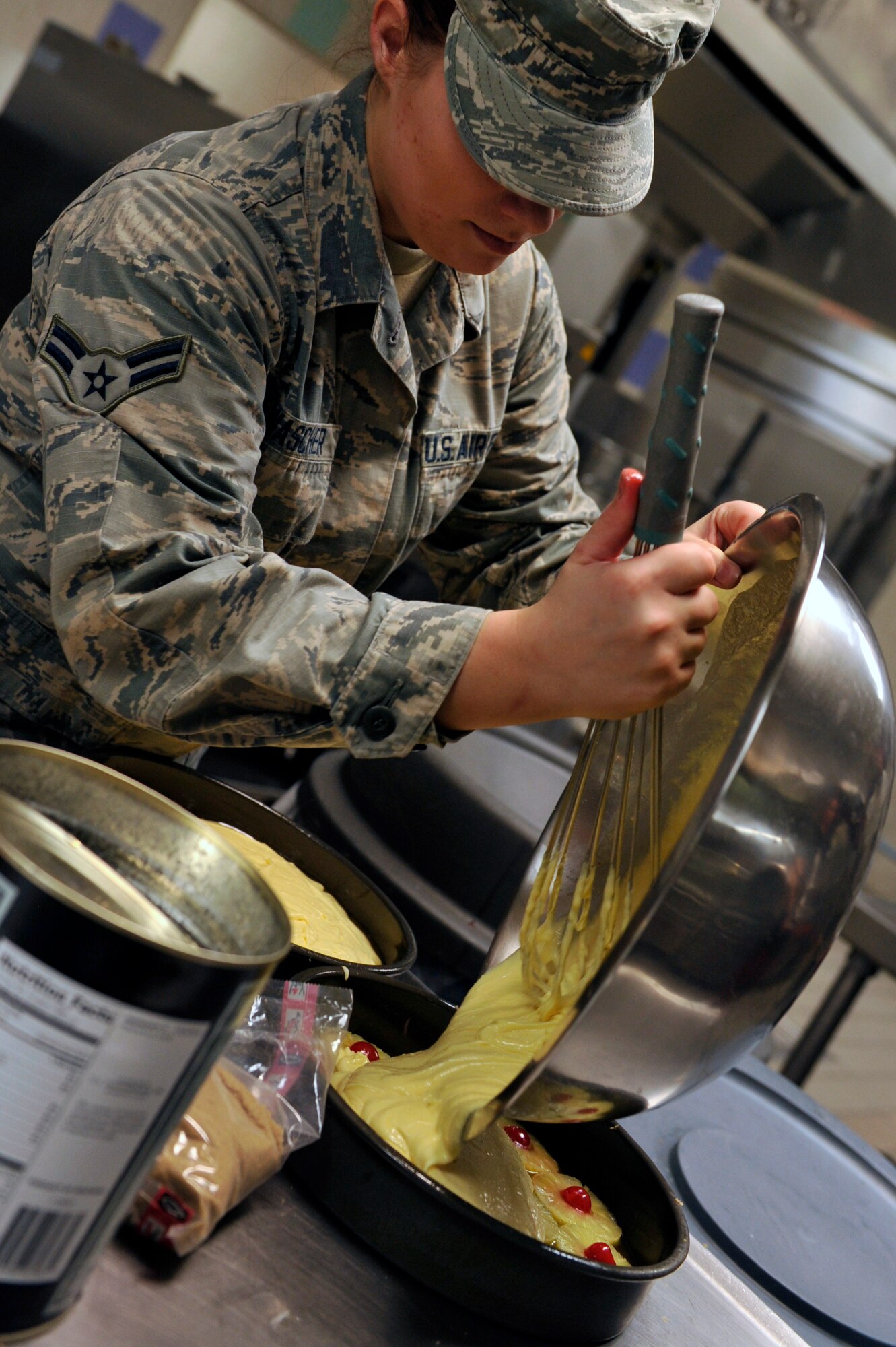 Airman 1st Class Jennifer Wascher, 56th Force Support Squadron food service journeyman, prepares pineapple upside down cake July 13, 2017 at Luke Air Force Base, Ariz. Wascher participated in a two week long Chef Mentor Program to further her culinary skills.  (U.S. Air Force photo by Airman 1st Class Pedro Mota)