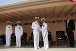 PORT HUENEME, Calif.—Naval Surface Warfare Center, Port Hueneme Division (NSWC PHD), held a change of command ceremony, July 10, where Capt. Stephen H. Murray relinquished command to Capt. Rafael “Ray” A. Acevedo. Pictured, from left to right, Lt. j.g. Victor B. Stevens, deputy chaplain, Naval Base Ventura County, Capt. Rafael “Ray” A. Acevedo, Capt. Stephen H. Murray, being presented with a Meritorious Service Medal and citation by Rear Adm. John W. Ailes, deputy commander, Fleet Readiness Directorate, Space and Naval Warfare Systems Command, and Dr. William H. Luebke, technical director, NSWC PHD. 