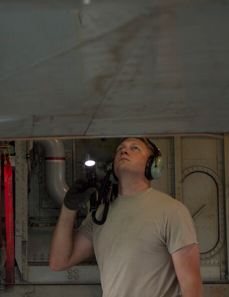 U.S Air Force Staff Sgt Bruce Boland, a hydraulic technician with the 763rd Expeditionary Aircraft Maintenance Unit, conducts a pre-flight inspection on a RC-135V/W Rivet Joint at Al Udeid Air Base, Qatar, July 4, 2017.  Boland is responsible for keeping the RC-135V/W Rivet Joint operational so it can provide near real time on-scene intelligence collection and analysis throughout the U.S. Air Forces Central Command area of responsibility. (U.S. Air Force photo by Tech. Sgt. Amy M. Lovgren)